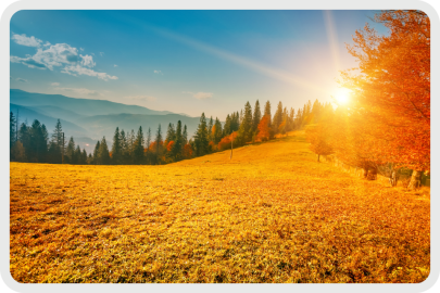 Sun rising over fall harvest fields.